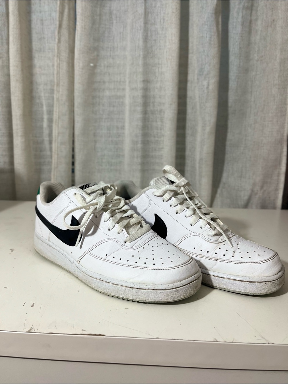 Nike Men’s White Leather Sneakers with Black Swoosh